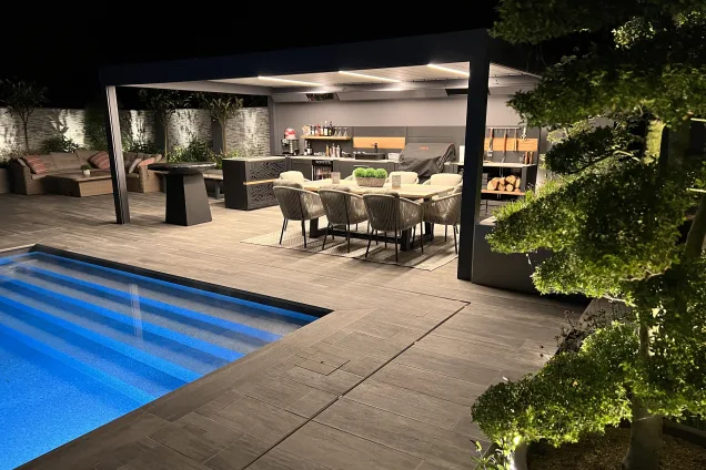 Outdoor kitchen in Copthorne West Sussex with outdoor seating on decking