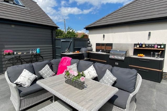 outdoor kitchen with seating area on patio in Whitstable, Kent