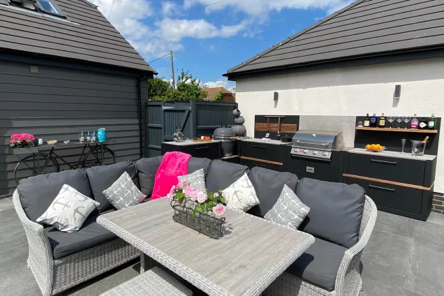 outdoor kitchen with seating area on patio in Whitstable, Kent