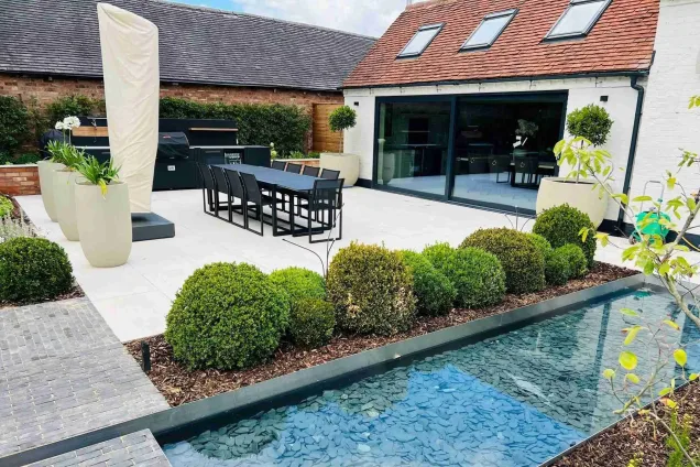 Outdoor kitchen in oldberrow henley-in-arden on patio with large dining table and cover