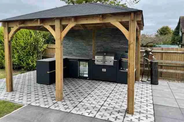 Outdoor kitchen in ashford kent on tiles under pergola