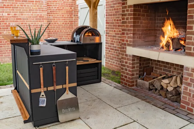 pizza oven on outdoor kitchen cabinet
