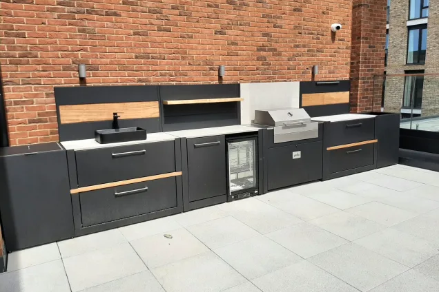 Outdoor kitchen in Avebury, Milton Keynes on roof terrace with sink, fridge and electric Voltiq bbq