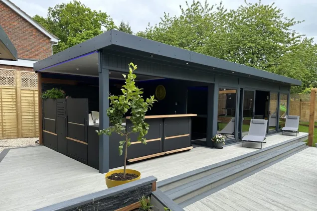 Outdoor kitchen in Berkhamsted under awning next to garden room