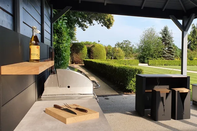 garden view from outdoor kitchen with bar seating