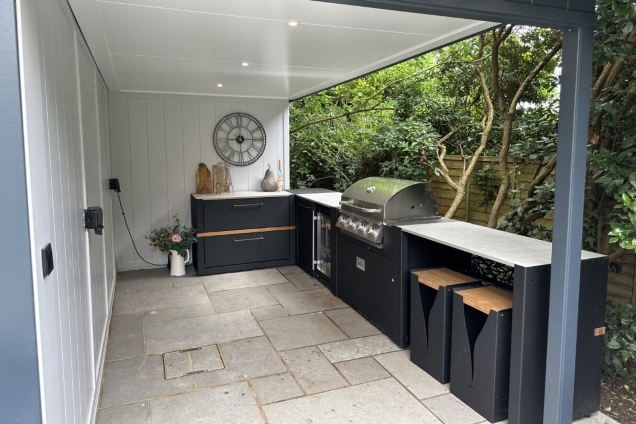 Outdoor kitchen in Reading, Berkshire with bar table and stools