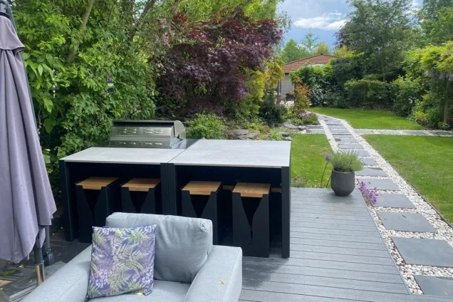 Outdoor kitchen in Bidborough, Tunbridge Wells on decking with bar table and stools