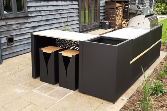 Outdoor kitchen in Bishops Stortford, Hertfordshire with bar table and stools