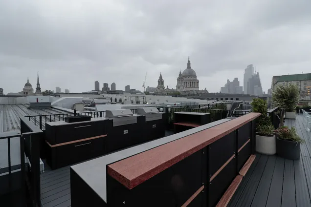 Outdoor kitchen in London with a sink and bbqs