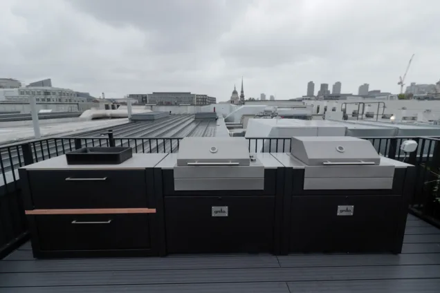 Outdoor kitchen in London with Voltiq bbqs and a sink