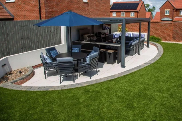 outdoor kitchen under roof with seating area at Warwick, Warwickshire