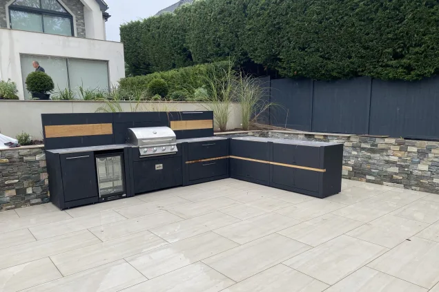 outdoor kitchen in Stone, Staffordshire with built-in fridge and Bull gas BBQ