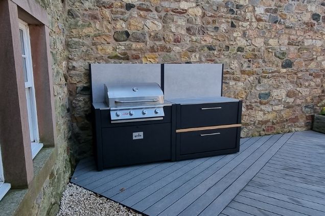 outdoor kitchen on patio next to stone wall in Skirwith, Penrith