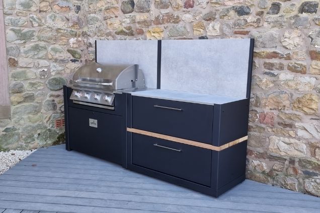 outdoor kitchen with Bull Gas BBQ on patio next to stone wall in Skirwith, Penrith