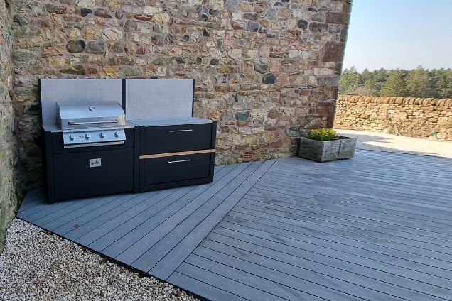 outdoor kitchen on patio next to stone wall in Skirwith, Penrith