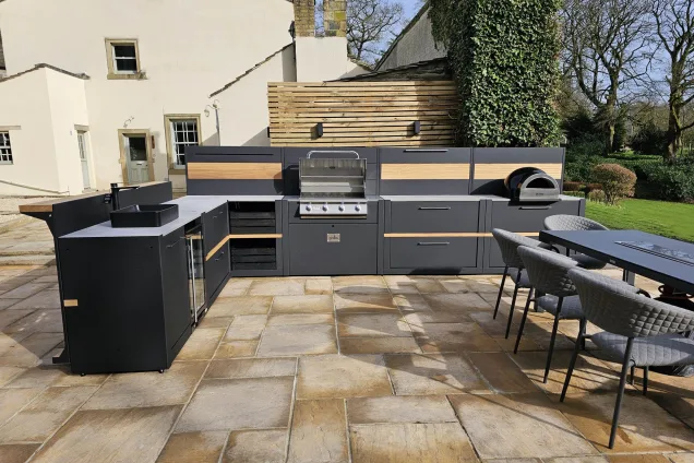 L-shaped outdoor kitchen in Skipton with sink and built-in fridge, North Yorkshire