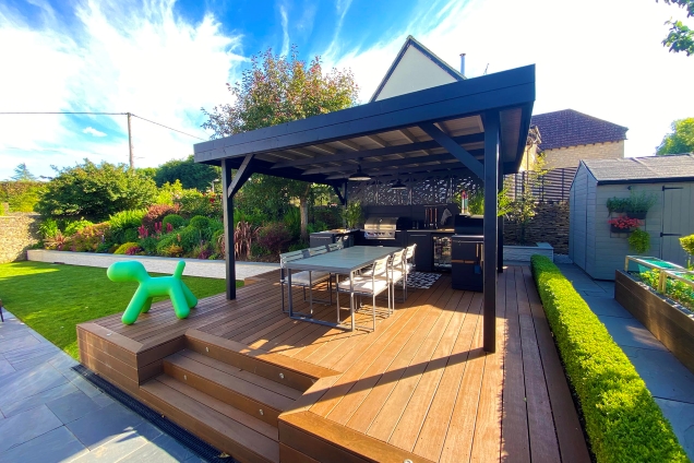 roofed outdoor kitchen on patio with seating area in Sherston, Malmesbury