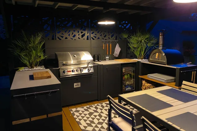roofed outdoor kitchen on patio at night in Sherston, Malmesbury