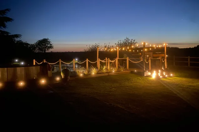 outdoor kitchen on pontoon in Saffron Walden, Essex, night view with fairy-lights