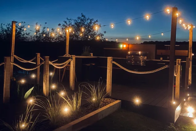 outdoor kitchen on pontoon in Saffron Walden, Essex, night view with fairy-lights