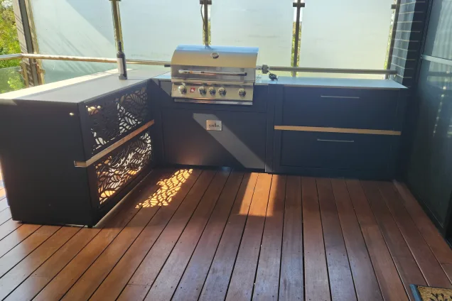 outdoor kitchen with bar and gas grill on terrace in Research, Melbourne