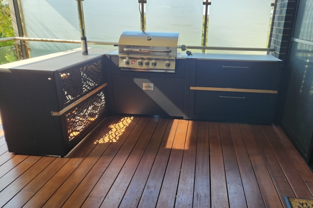 outdoor kitchen with bar and gas grill on terrace in Research, Melbourne