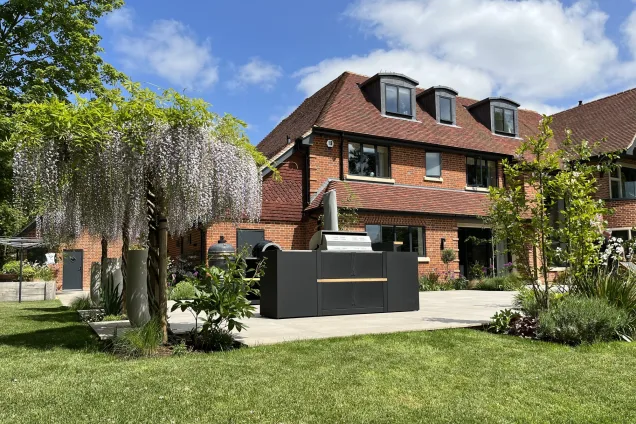 outdoor kitchen on patio with wisteria trees in Reading, Berkshire