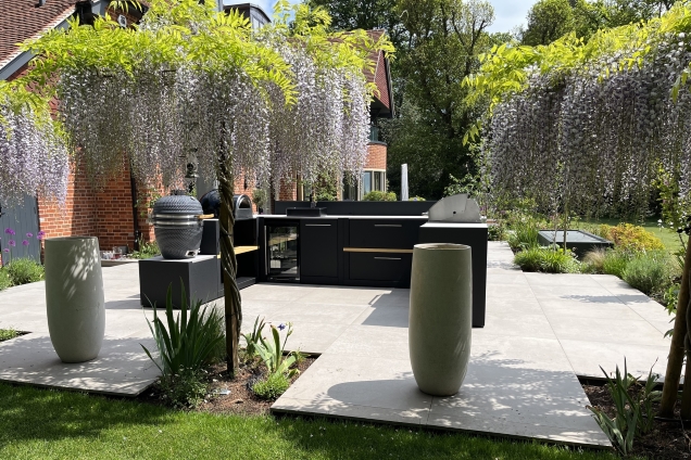 outdoor kitchen on patio with wisteria trees in Reading, Berkshire
