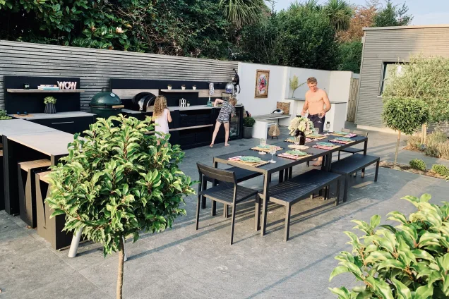 Outdoor kitchen in Bosham, Chichester with family using it