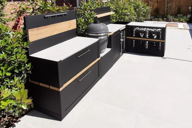 Outdoor kitchen in Brentwood, Essex with bar table and stools