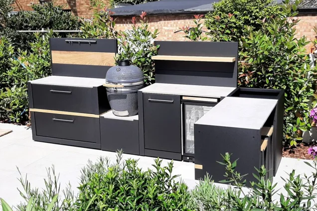 Outdoor kitchen in Brentwood, Essex with bar table and stools and gusto bbq