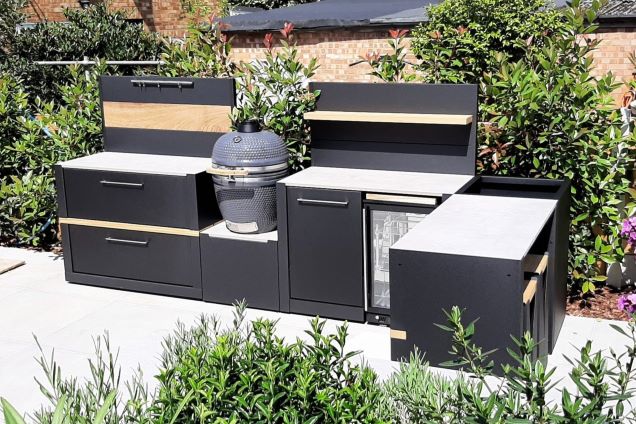 Outdoor kitchen in Brentwood, Essex in front of plants on patio