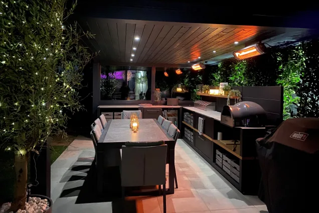 Outdoor kitchen in Canford Cliffs, Dorset with outdoor dining table and seating