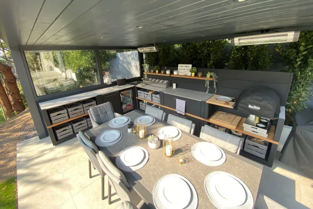 Outdoor kitchen in Canford Cliffs, Dorset with table laid