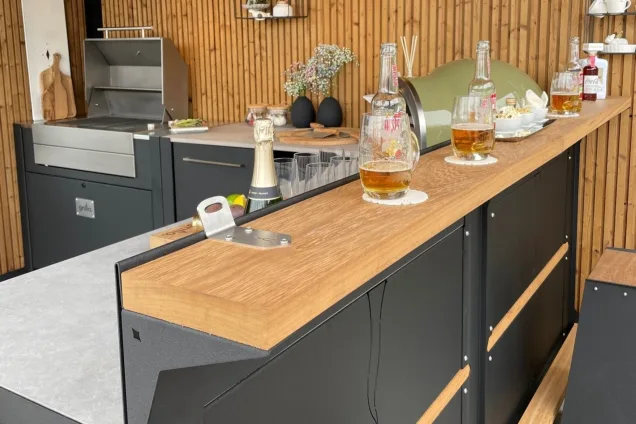 Outdoor kitchen in Chelsea flower show with beer boss on wooden bar