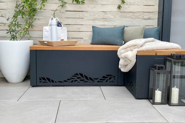 Outdoor kitchen in Chelsea flower show with bench seating on patio
