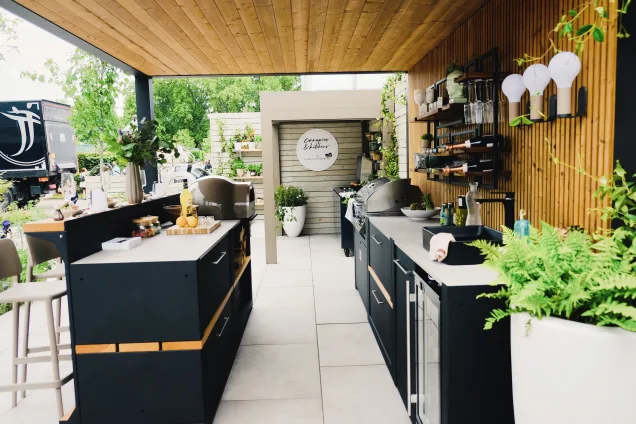 Outdoor kitchen in Chelsea flower show with pizza oven and bbq