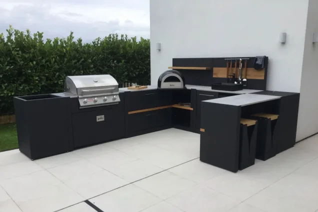 outdoor kitchen with Bull Gas Grill and wood-fired pizza oven in New Longton, Presto
