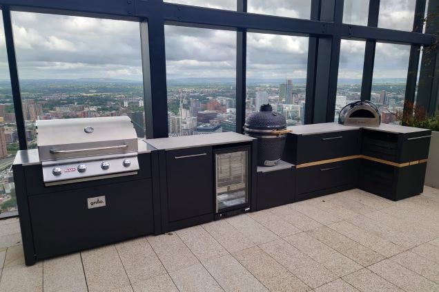 Outdoor kitchen in Manchester with pizza oven, gas bbq and drinks fridge