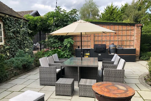 Outdoor kitchen in Evesham with outdoor seating area