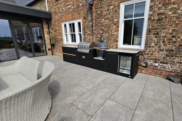 outdoor kitchen next to aged brick wall in Middlesbrough, North Yorkshire