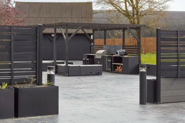 Outdoor kitchen in Essex on a large patio with a gas bbq and pizza oven