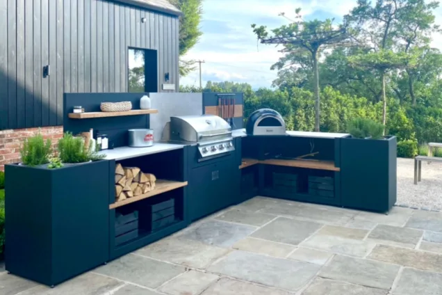 outdoor kitchen with wood-fired pizza oven and Bull Gas Grill in Macclesfield, Cheshire