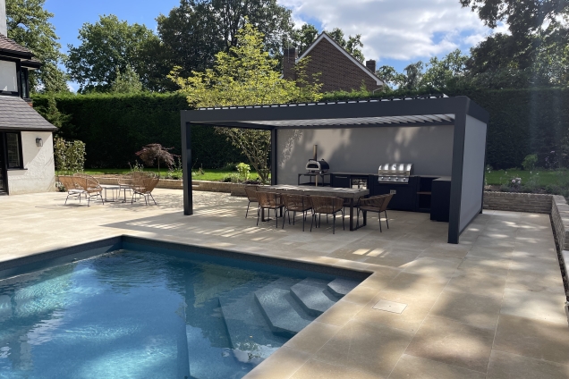 Outdoor kitchen in sussex with large pool