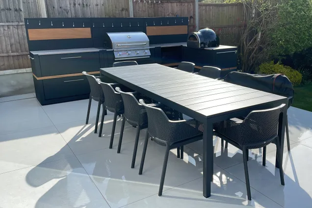 Outdoor kitchen in Hertford with bull bbq and pizza oven large outdoor table