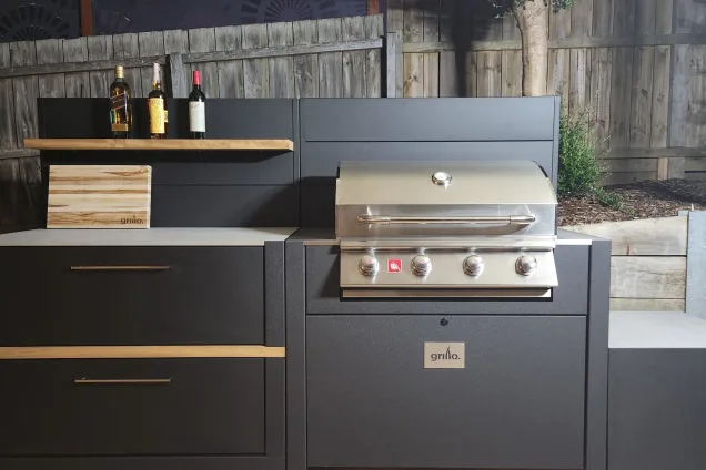 Outdoor kitchen in Geelong with bull gas bbq and storage cabinet in evening