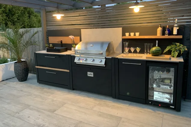 Outdoor kitchen in sussex with bull bbq and storage units and sink