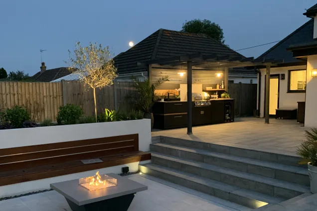 Outdoor kitchen in sussex on decking in the evening