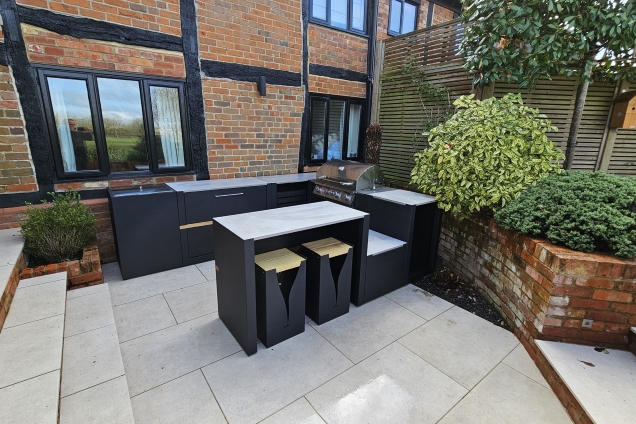Outdoor kitchen in Berkshire with bar table and stools and drinks station