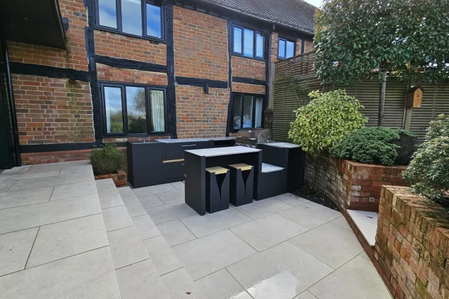 Outdoor kitchen in Berkshire with gas bbq and drinks station and bar seating